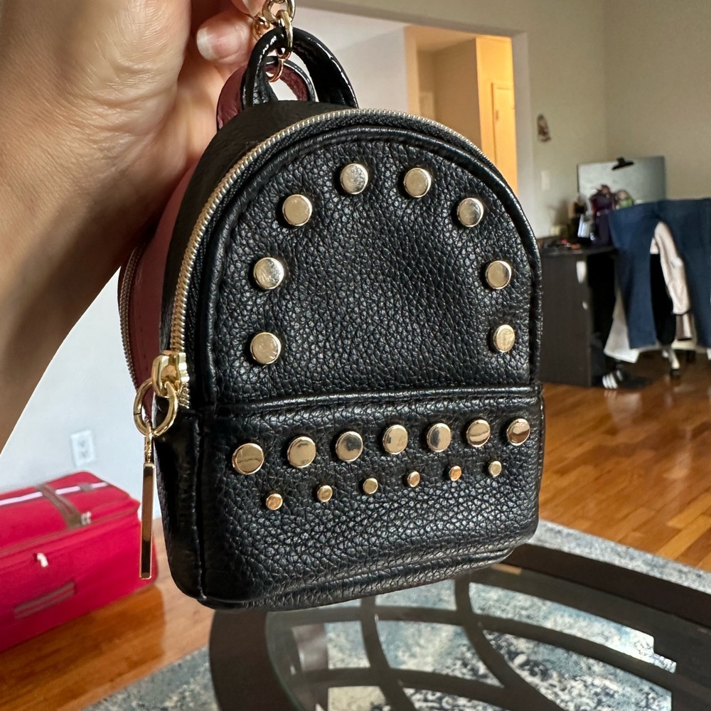 Victoria’s Secret coin pouch, and you can put minimal makeup stuff